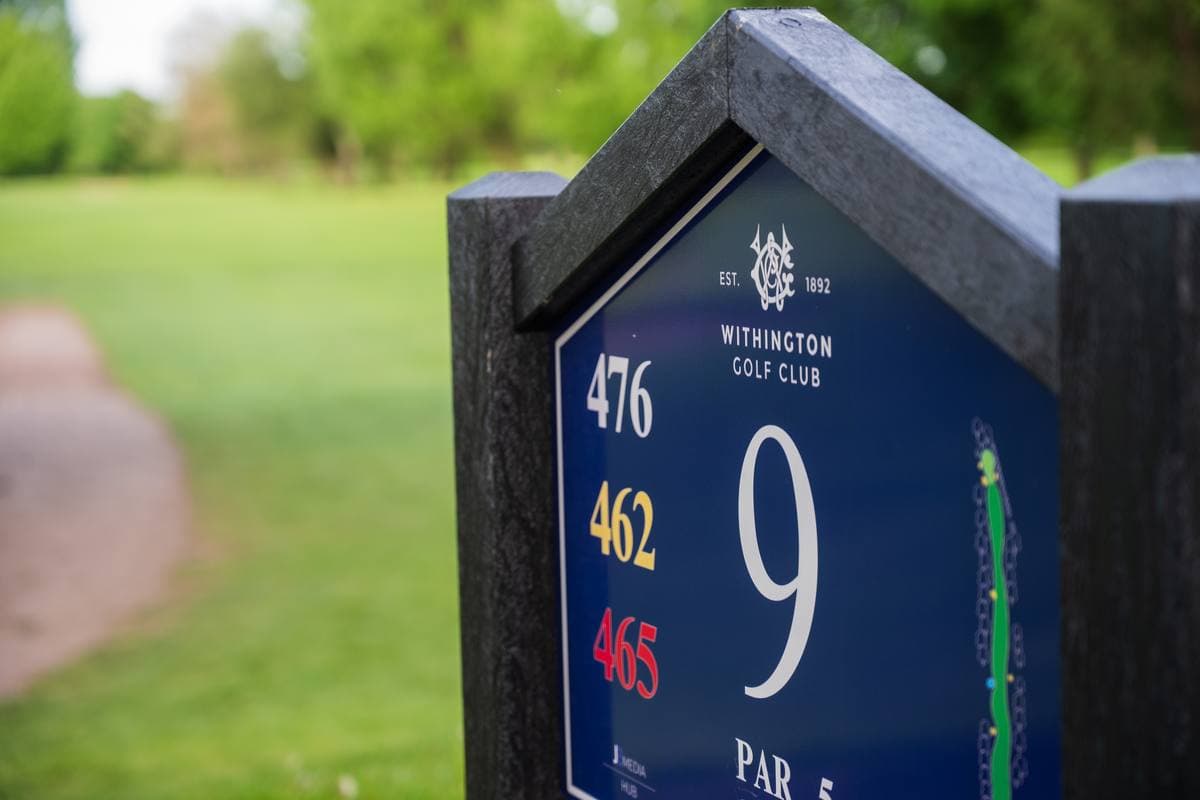 A JB tee marker in position on the course