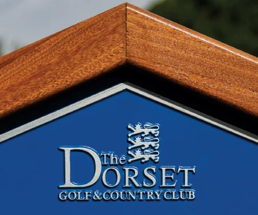The crest of The Dorset Golf & Country Club on its JB Golf tee sign