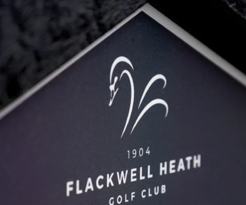 The crest of Flackwell Heath Golf Club on its JB Golf tee sign