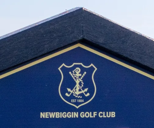 The crest of Newbiggin Golf Club on its JB Golf tee sign