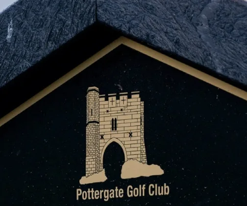 The crest of Pottergate Golf Club on its JB Golf tee sign
